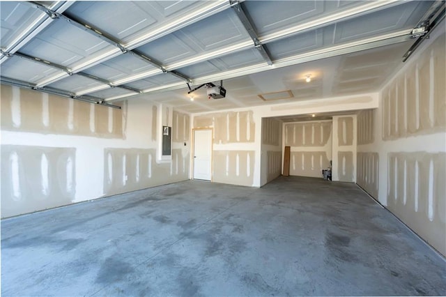 garage with electric panel and a garage door opener