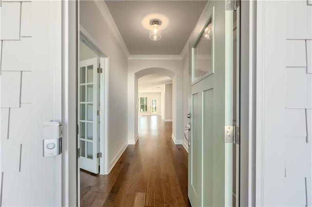 hall featuring dark hardwood / wood-style flooring and ornamental molding