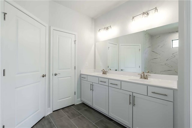 bathroom featuring tile patterned flooring and vanity