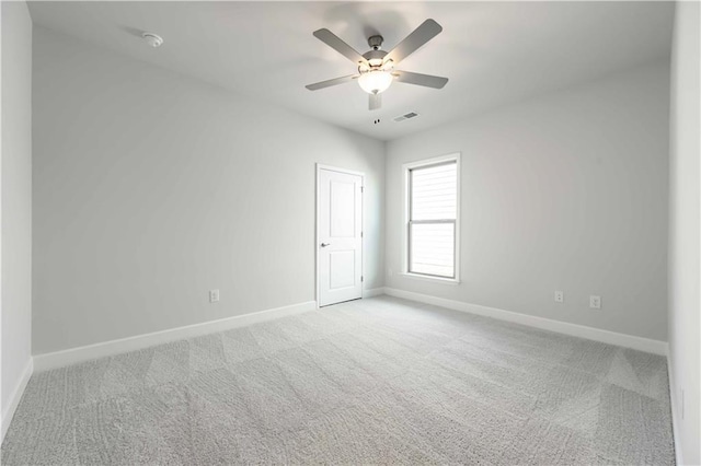 unfurnished room with light carpet and ceiling fan