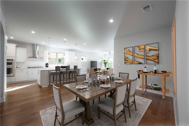 dining room with dark hardwood / wood-style flooring