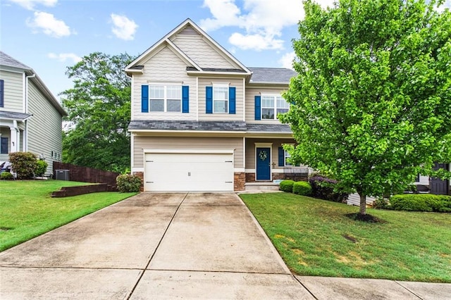 craftsman-style house with a garage, fence, driveway, and a front lawn