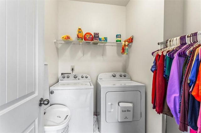 laundry area featuring laundry area and washer and clothes dryer