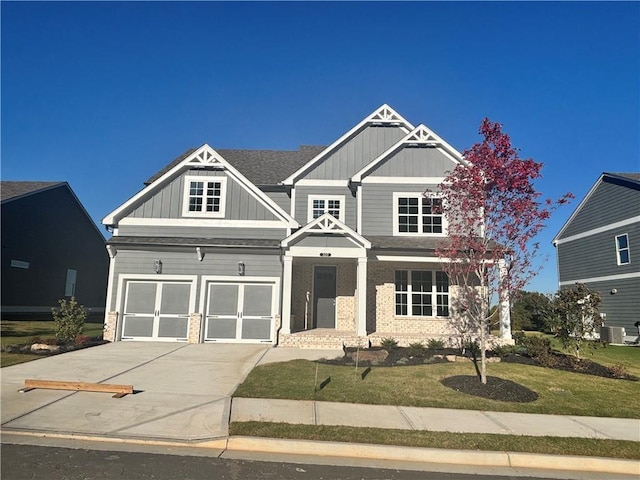 320 Willow Cv, Canton, GA 30114 - craftsman inspired home with driveway, board and batten siding, a front yard, central AC, and a garage