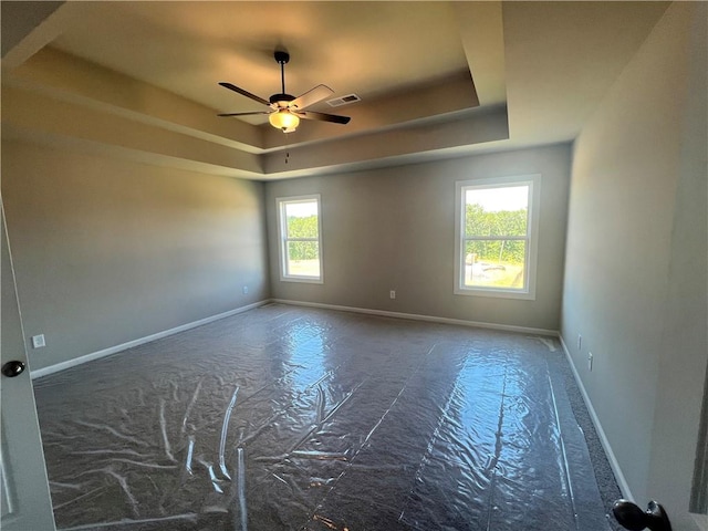 320 Willow Cv, Canton, GA 30114 - spare room with visible vents, baseboards, a ceiling fan, and a raised ceiling