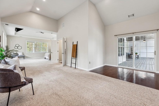 living room with hardwood / wood-style flooring and vaulted ceiling