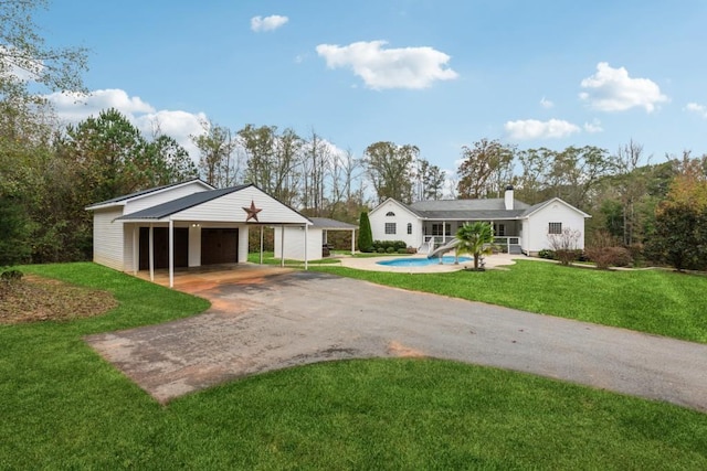 single story home with a front yard and a carport