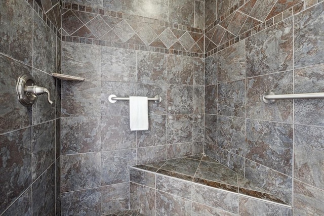 bathroom with tiled shower