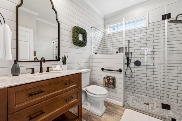 bathroom with crown molding, hardwood / wood-style floors, vanity, and an enclosed shower