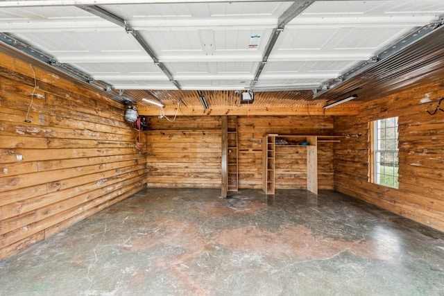 garage featuring wooden walls