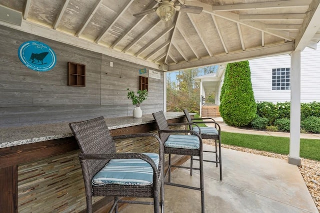 view of patio featuring ceiling fan