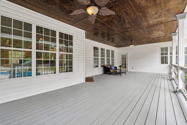 wooden deck with ceiling fan