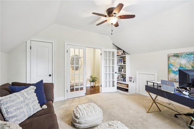 carpeted office featuring ceiling fan, lofted ceiling, and french doors