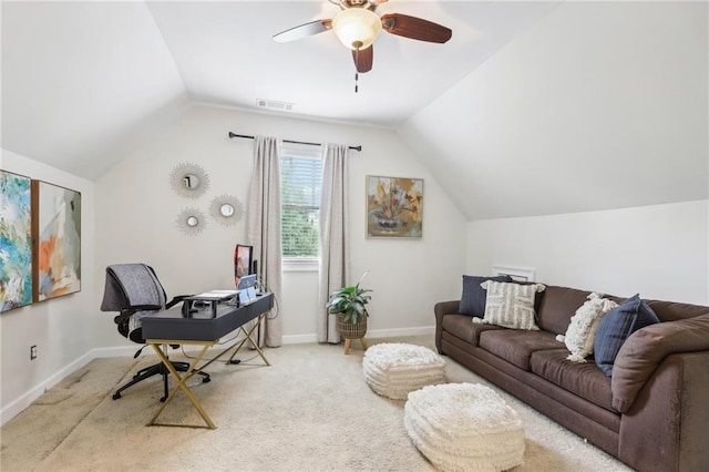 carpeted home office featuring ceiling fan and vaulted ceiling