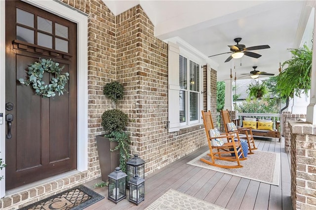 deck featuring ceiling fan and a porch