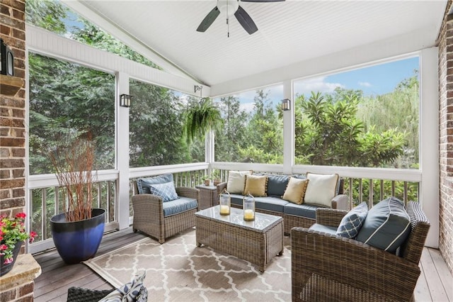 sunroom / solarium featuring vaulted ceiling and ceiling fan