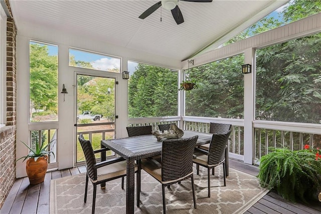 sunroom / solarium with ceiling fan and lofted ceiling