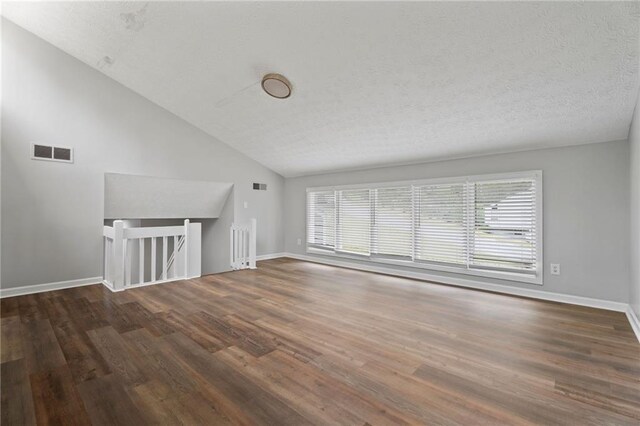 700 Bayliss Dr, Marietta, GA 30068 - unfurnished living room featuring stairs, a fireplace, hardwood / wood-style flooring, and a textured ceiling