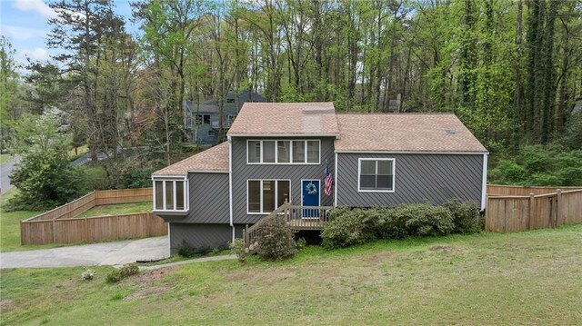 700 Bayliss Dr, Marietta, GA 30068 - view of front of property with stairs, a front yard, a deck, and fence