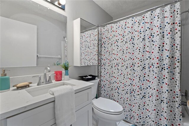 700 Bayliss Dr, Marietta, GA 30068 - ensuite bathroom featuring a textured ceiling, connected bathroom, wood finished floors, vanity, and shower / bathtub combination