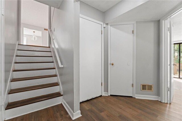 700 Bayliss Dr, Marietta, GA 30068 - spare room featuring dark wood-style flooring, a textured ceiling, baseboards, and visible vents