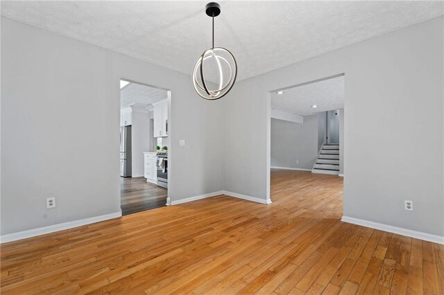 700 Bayliss Dr, Marietta, GA 30068 - kitchen featuring dark wood-style flooring, light countertops, a sink, and stainless steel appliances