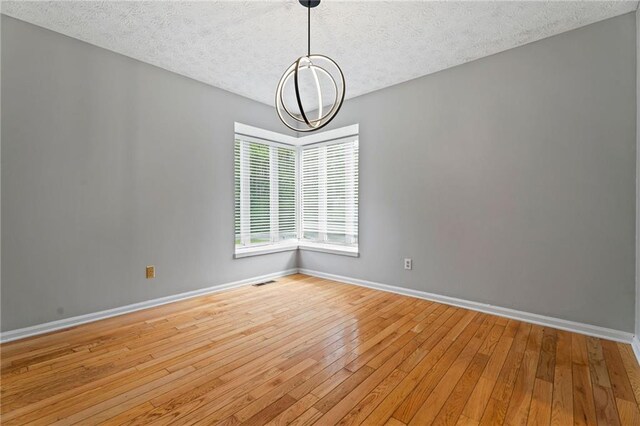 700 Bayliss Dr, Marietta, GA 30068 - kitchen featuring white cabinetry, light countertops, stainless steel dishwasher, a sink, and dark wood-style floors
