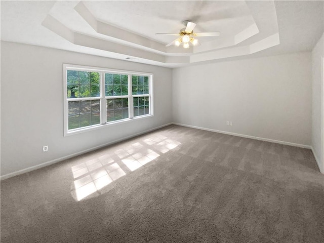 30 Trelawney Ct, Covington, GA 30016 - carpeted empty room with baseboards, a ceiling fan, and a tray ceiling