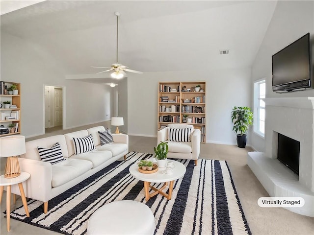 30 Trelawney Ct, Covington, GA 30016 - carpeted living room with a ceiling fan, visible vents, high vaulted ceiling, baseboards, and a fireplace with raised hearth
