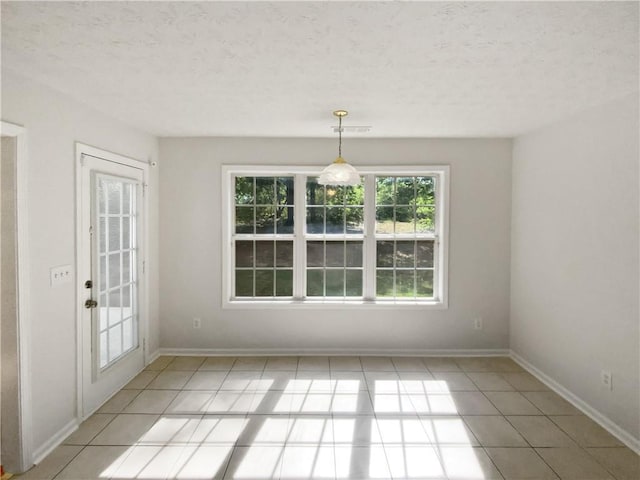 30 Trelawney Ct, Covington, GA 30016 - unfurnished dining area with light tile patterned floors, baseboards, and visible vents