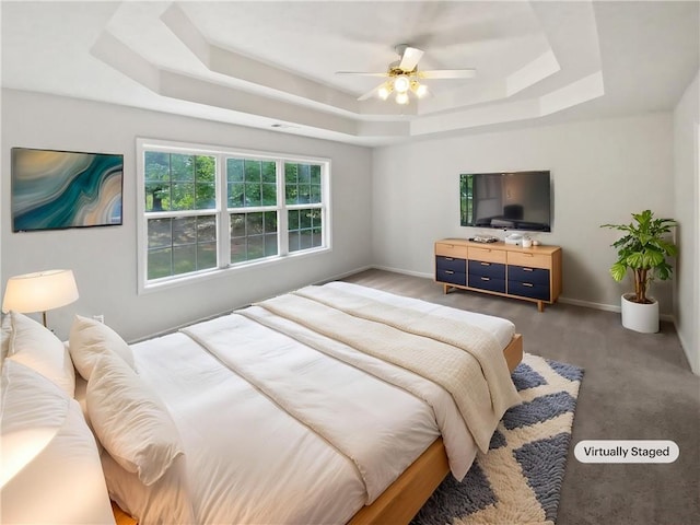 30 Trelawney Ct, Covington, GA 30016 - bedroom with carpet, a ceiling fan, baseboards, a tray ceiling, and visible vents
