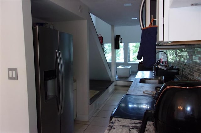 2814 Shellbark Rd, Decatur, GA 30035 - kitchen with stainless steel fridge with ice dispenser, a sink, light tile patterned floors, and electric range oven