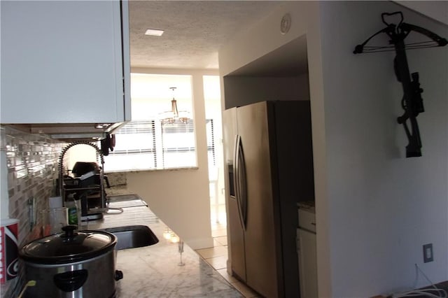 2814 Shellbark Rd, Decatur, GA 30035 - kitchen with stainless steel fridge with ice dispenser and a textured ceiling