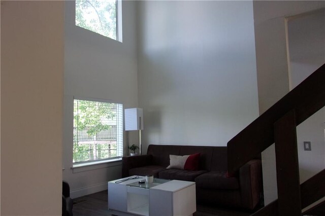 2814 Shellbark Rd, Decatur, GA 30035 - living room featuring a towering ceiling, wood finished floors, and baseboards