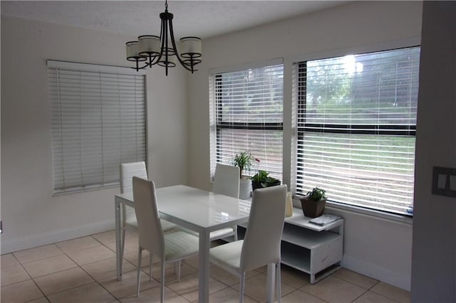 2814 Shellbark Rd, Decatur, GA 30035 - dining room featuring a chandelier, light tile patterned flooring, and baseboards
