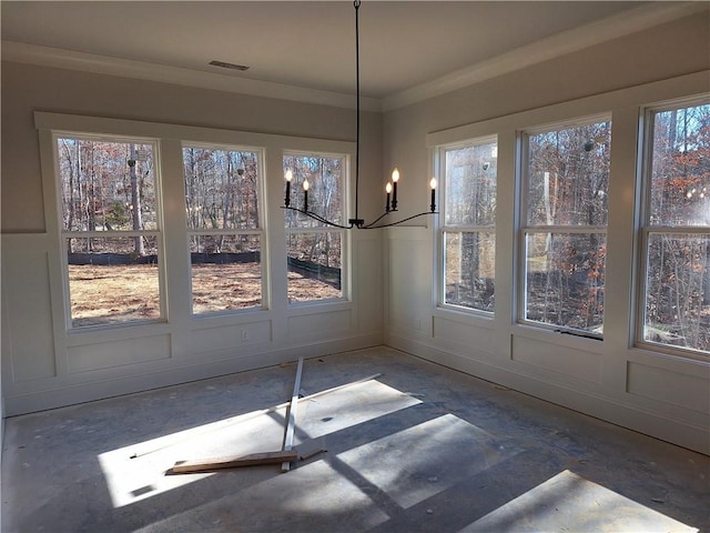 unfurnished dining area featuring crown molding