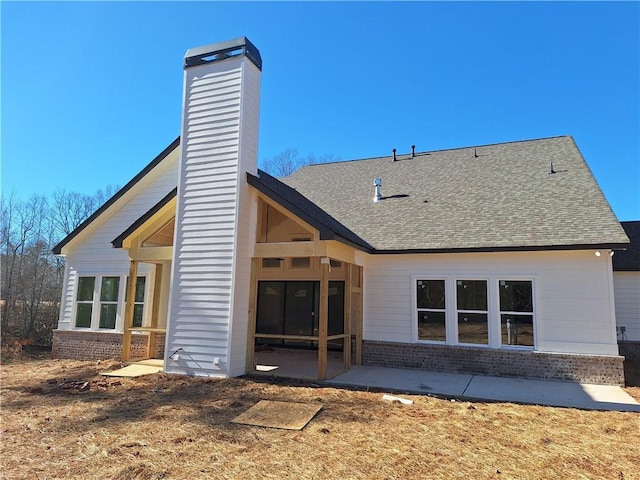 back of property featuring a patio area