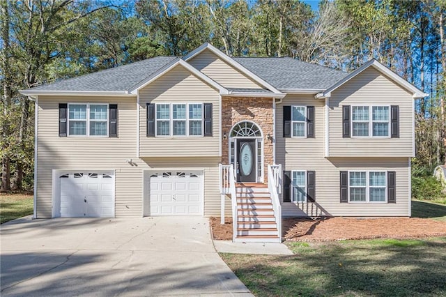 bi-level home featuring a garage