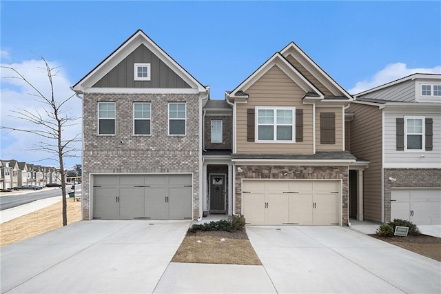 view of front of property featuring driveway, an attached garage, and board and batten siding