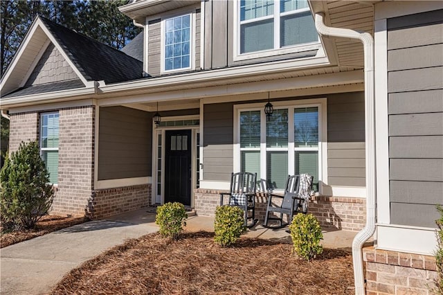 view of exterior entry featuring a porch