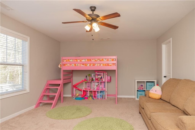 playroom featuring ceiling fan and carpet flooring