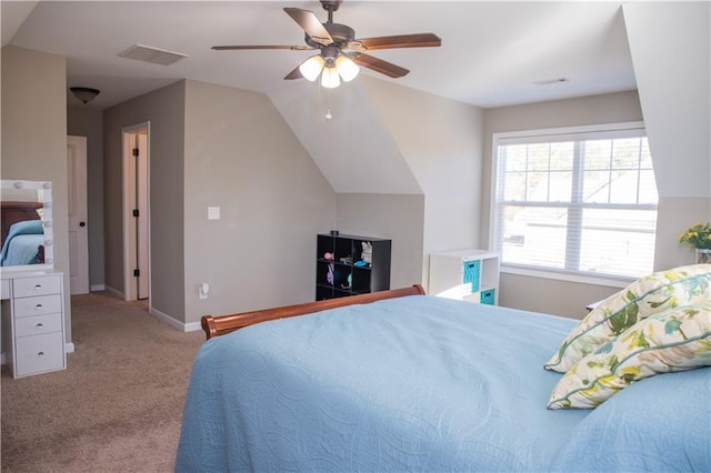 bedroom with lofted ceiling, light colored carpet, and ceiling fan