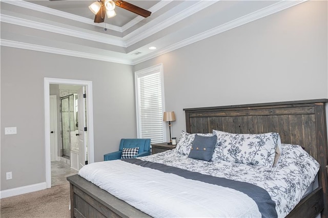 bedroom with ceiling fan, light colored carpet, ornamental molding, and a tray ceiling