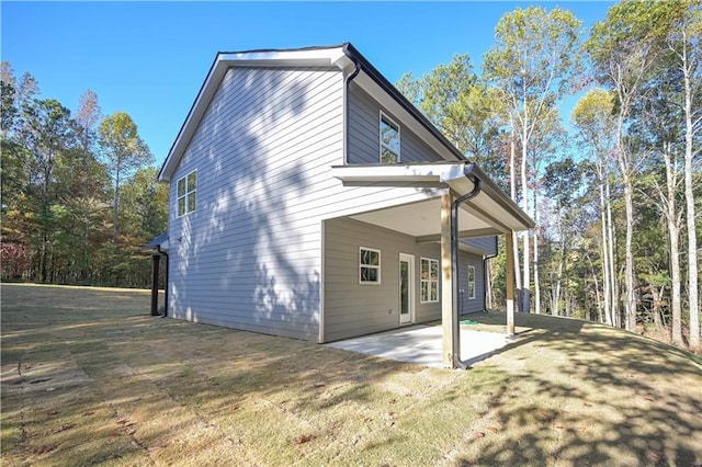 view of side of property with a patio area