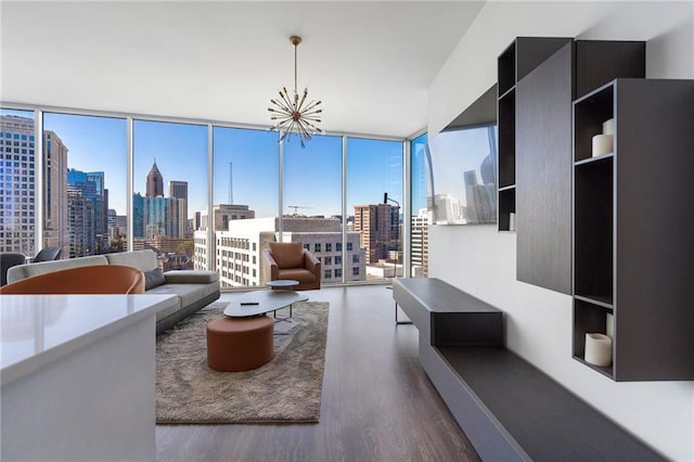 living area featuring expansive windows, a city view, and wood finished floors