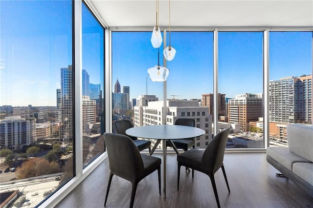 sunroom featuring a city view