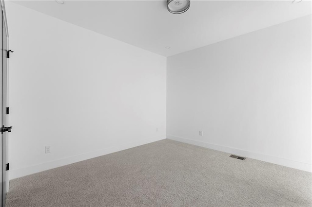 unfurnished room featuring carpet flooring