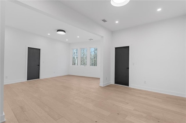 spare room featuring light hardwood / wood-style flooring