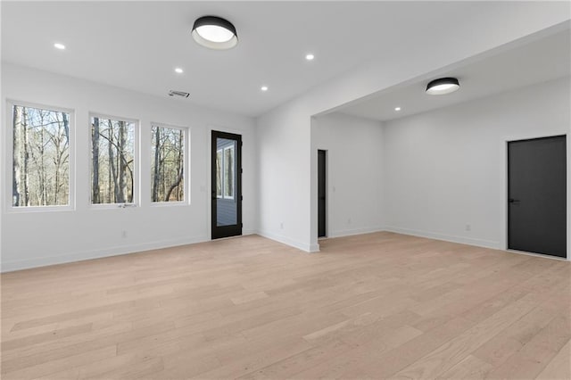 unfurnished room featuring light hardwood / wood-style floors