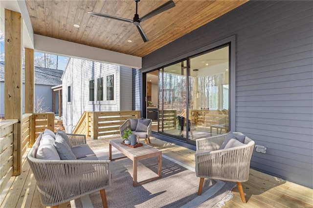 sunroom / solarium featuring wooden ceiling and ceiling fan